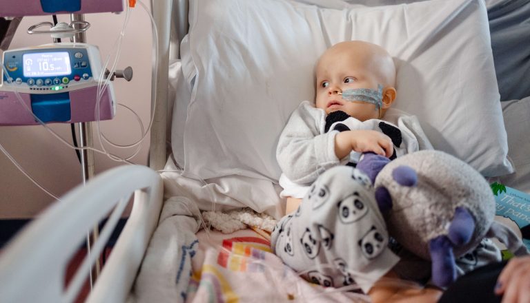 Lucy looking at machine in hospital