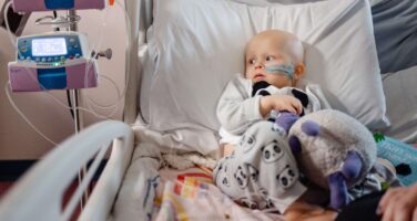 Lucy looking at machine in hospital