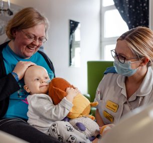 Lucy, mum and nurse in hospital bed