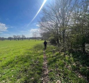 Zach walking in field