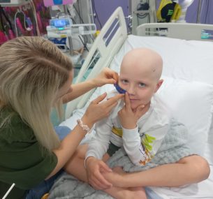 Rufus in hospital bed with feeding tube