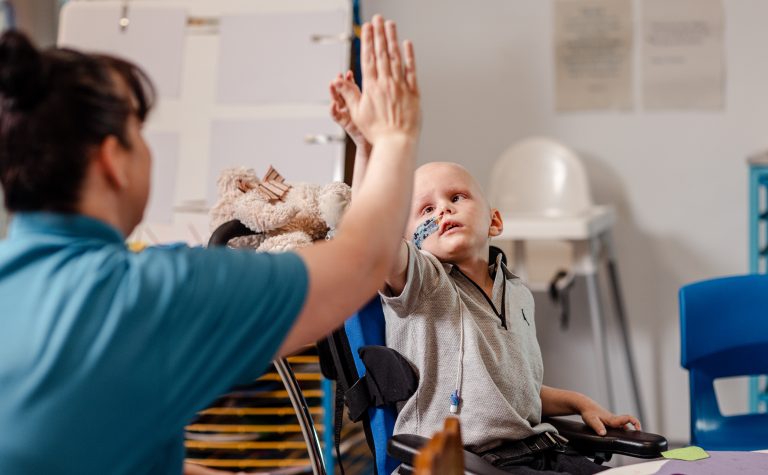 Jack high fiving a nurse