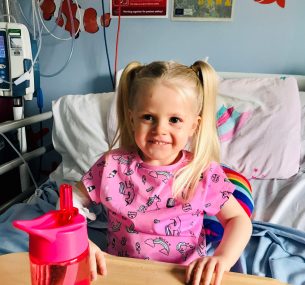 Matilda in hospital bed pink t shirt