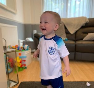 Stanley smiling in football t shirt