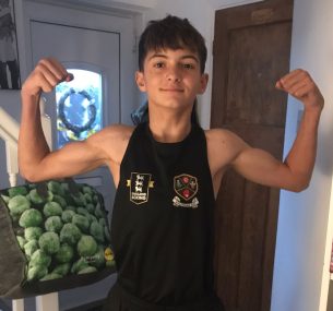Blue flexing his muscles aged 14 in 2023
