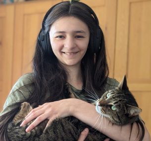 Caroline smiling holding cat