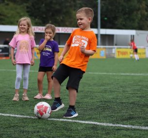 Theo in orange charity t shirt