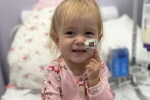 Orla smiling in hospital bed