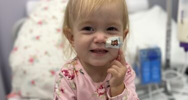 Orla smiling in hospital bed