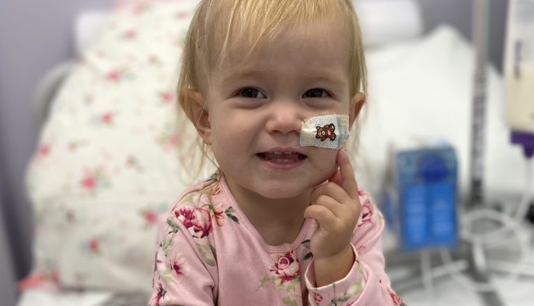 Orla smiling in hospital bed