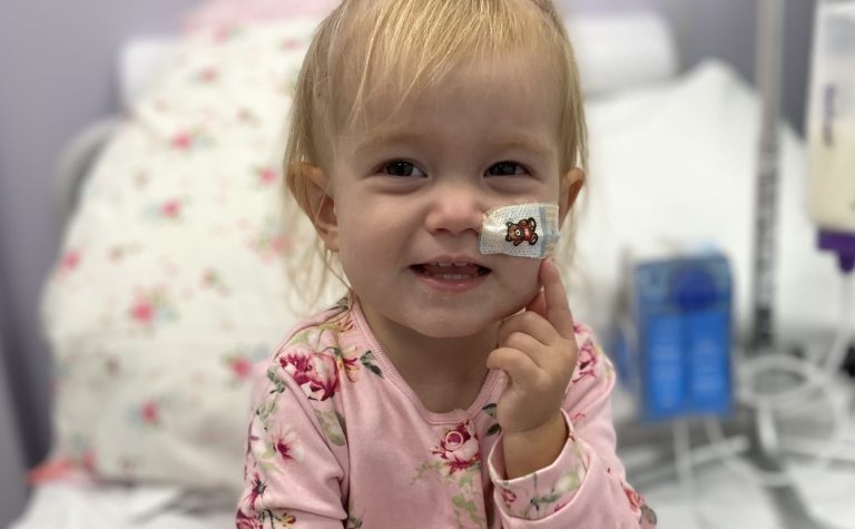 Orla smiling in hospital bed