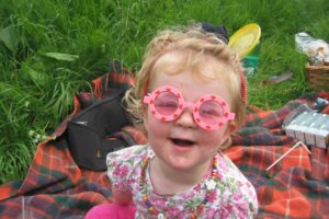 Libby as child in sunglasses