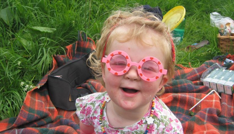 Libby as child in sunglasses