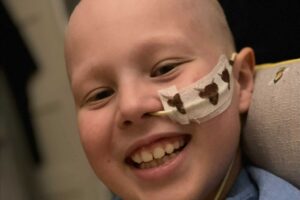 Harrison smiling with nose tube
