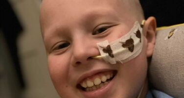 Harrison smiling with nose tube