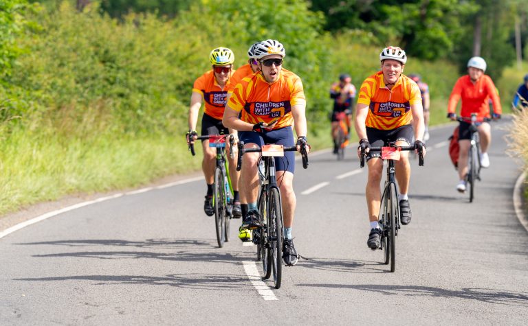 Group taking part in charity cycle
