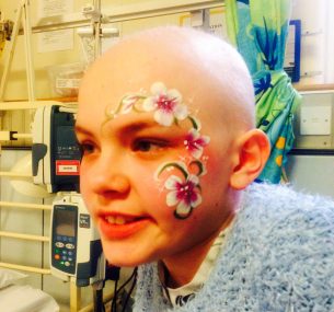 Kira with facepaint in hospital