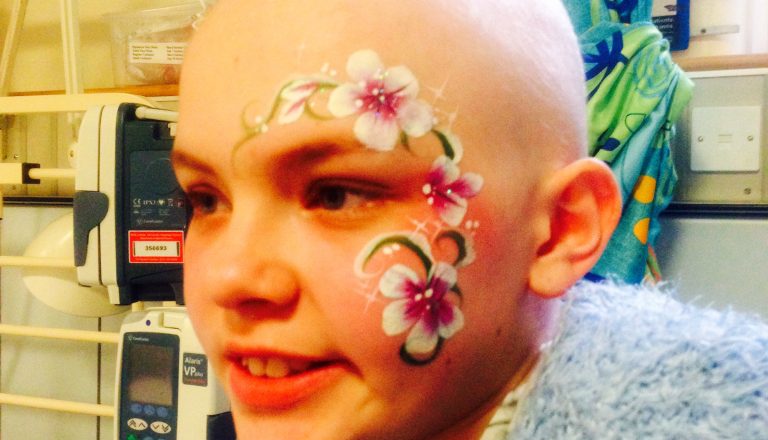 Kira with facepaint in hospital