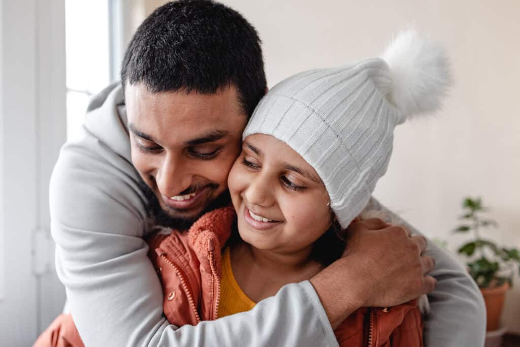 Dad and daughter hugging