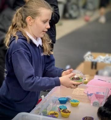 Izzy at her cupcake fundraiser for Children with Cancer UK